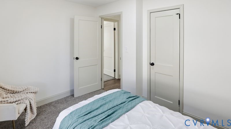 331 Walnut Street Petersburg, VA 23803 - Photo 13 of 34 a bedroom with a bed and a shower