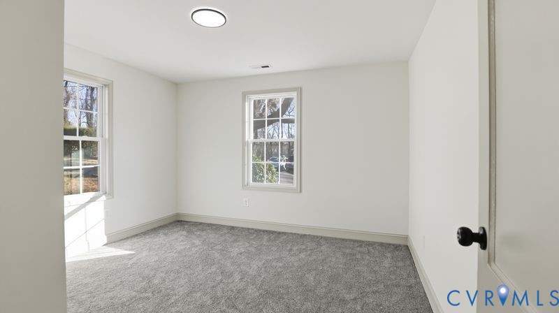 331 Walnut Street Petersburg, VA 23803 - Photo 18 of 34 an empty room with windows