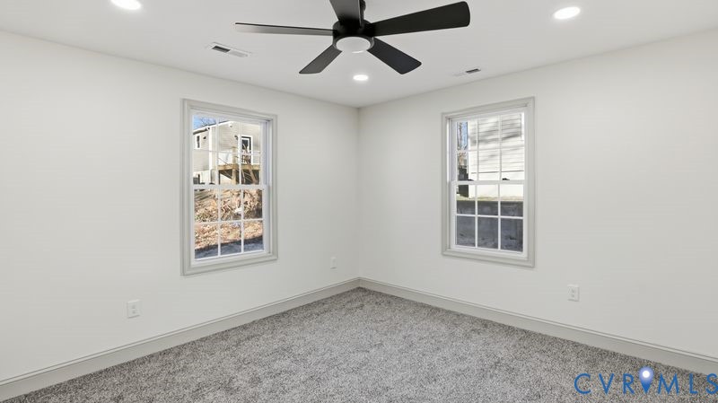 331 Walnut Street Petersburg, VA 23803 - Photo 24 of 34 an empty room with a window and a fan