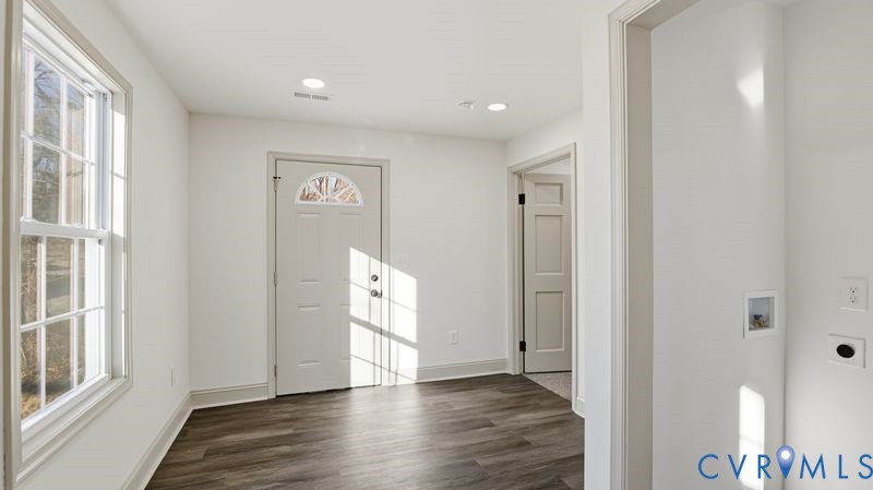 331 Walnut Street Petersburg, VA 23803 - Photo 26 of 34 a view of an empty room with wooden floor and a window