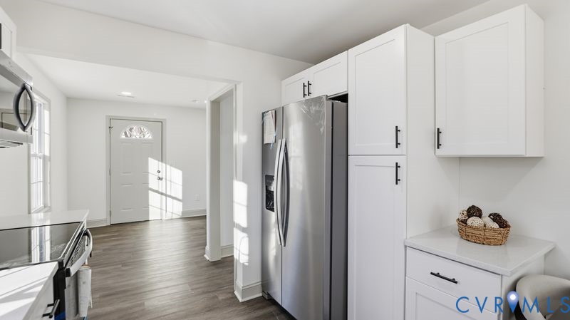 331 Walnut Street Petersburg, VA 23803 - Photo 5 of 34 a kitchen with stainless steel appliances a refrigerator and a stove