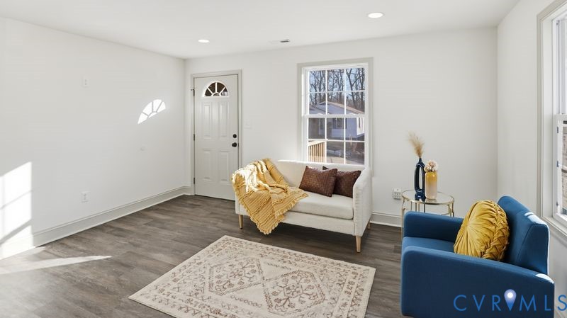 331 Walnut Street Petersburg, VA 23803 - Photo 6 of 34 a living room with furniture and a rug