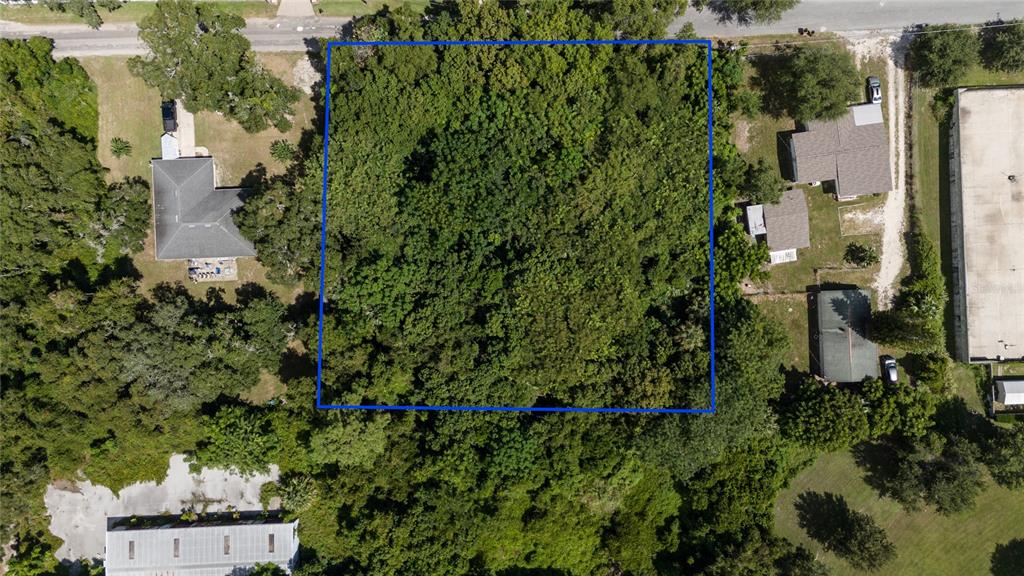 3rd Street Leesburg, FL 34748 - Photo 2 of 14 an aerial view of a house with a yard