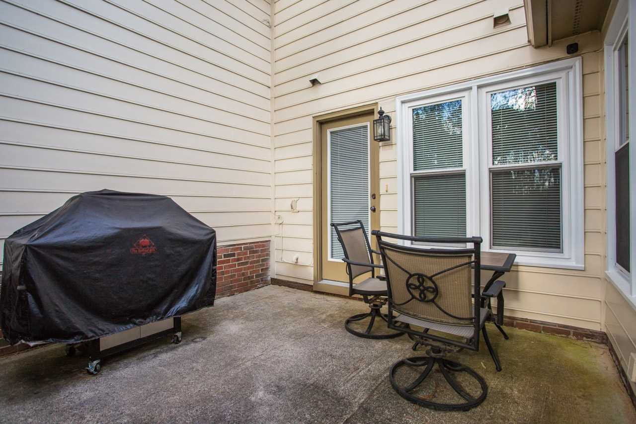 6705 Twin Tree Court Raleigh, NC 27613 - Photo 17 of 20 Patio off the kitchen and family room and leads to common open space in the back! Patio/Deck
