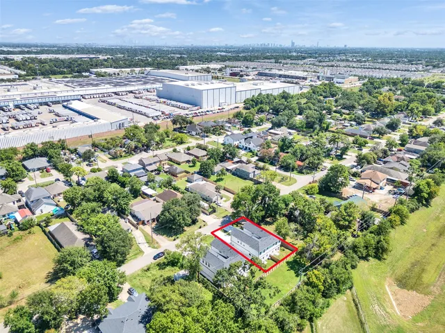 wooden floor in an empty room with a bathroom