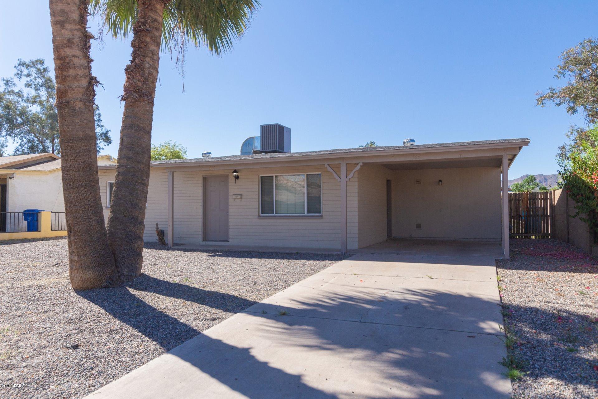 1837 West Vineyard Road Phoenix, AZ 85041 - Photo 2 of 30 a front view of a house with a yard
