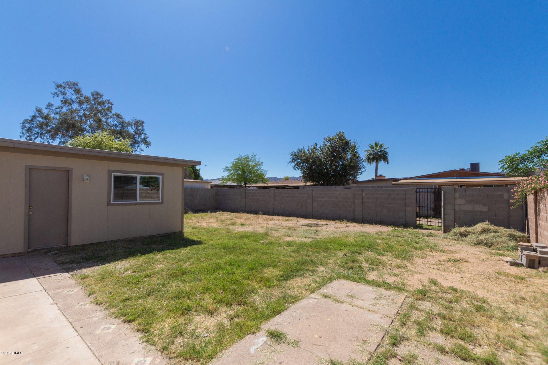 1837 West Vineyard Road Phoenix, AZ 85041 - Photo 23 of 30 a house with yard in front of it