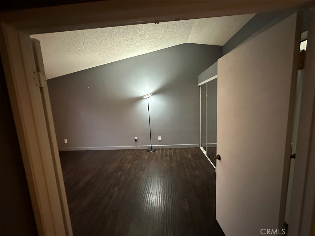 165 Racquet Club Drive Compton, CA 90220 - Photo 24 of 47 a view of an empty room with wooden floor