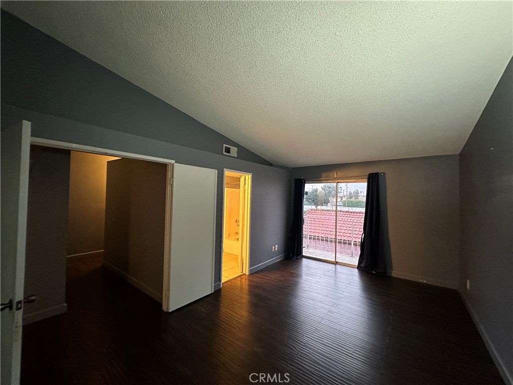 165 Racquet Club Drive Compton, CA 90220 - Photo 27 of 47 an empty room with wooden floor and windows
