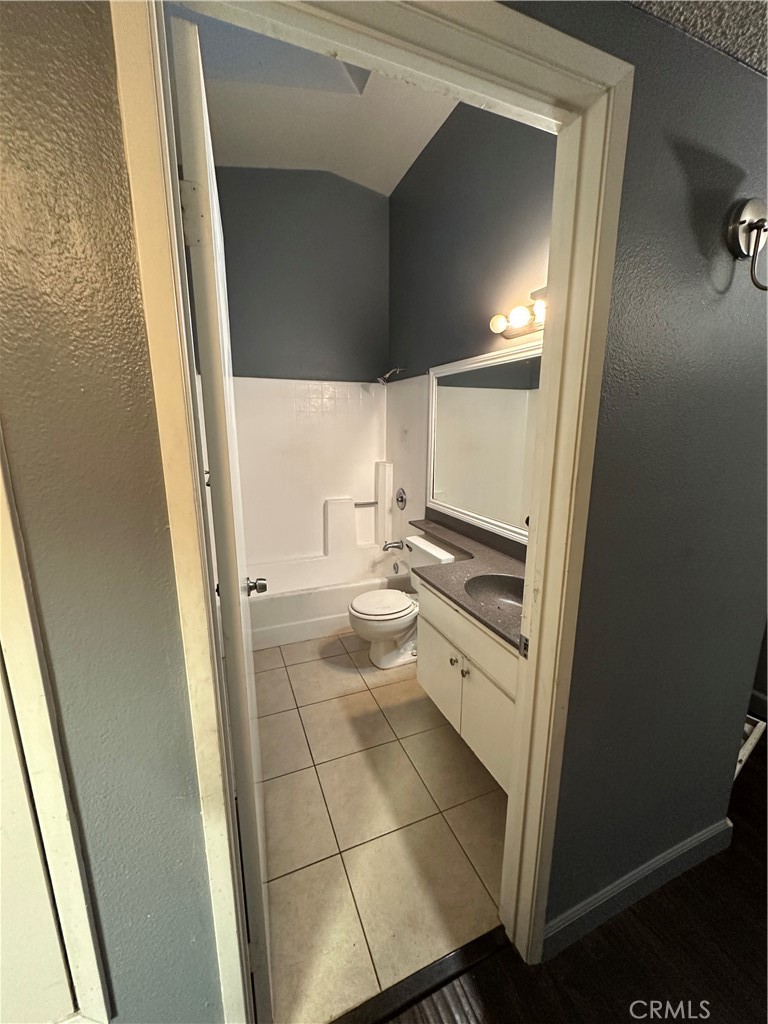 165 Racquet Club Drive Compton, CA 90220 - Photo 33 of 47 a bathroom with a sink and a mirror