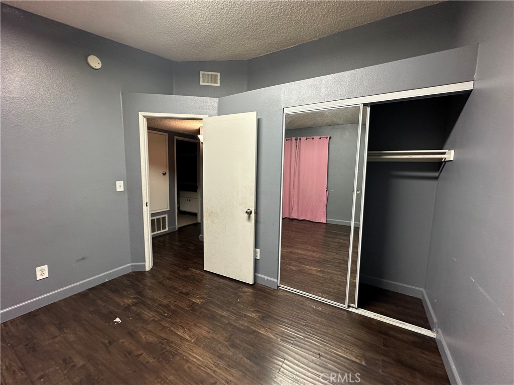 165 Racquet Club Drive Compton, CA 90220 - Photo 38 of 47 a view of hallway with wooden floor