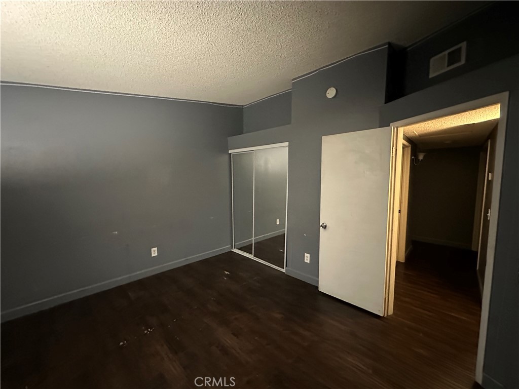 165 Racquet Club Drive Compton, CA 90220 - Photo 40 of 47 a view of an empty room with wooden floor