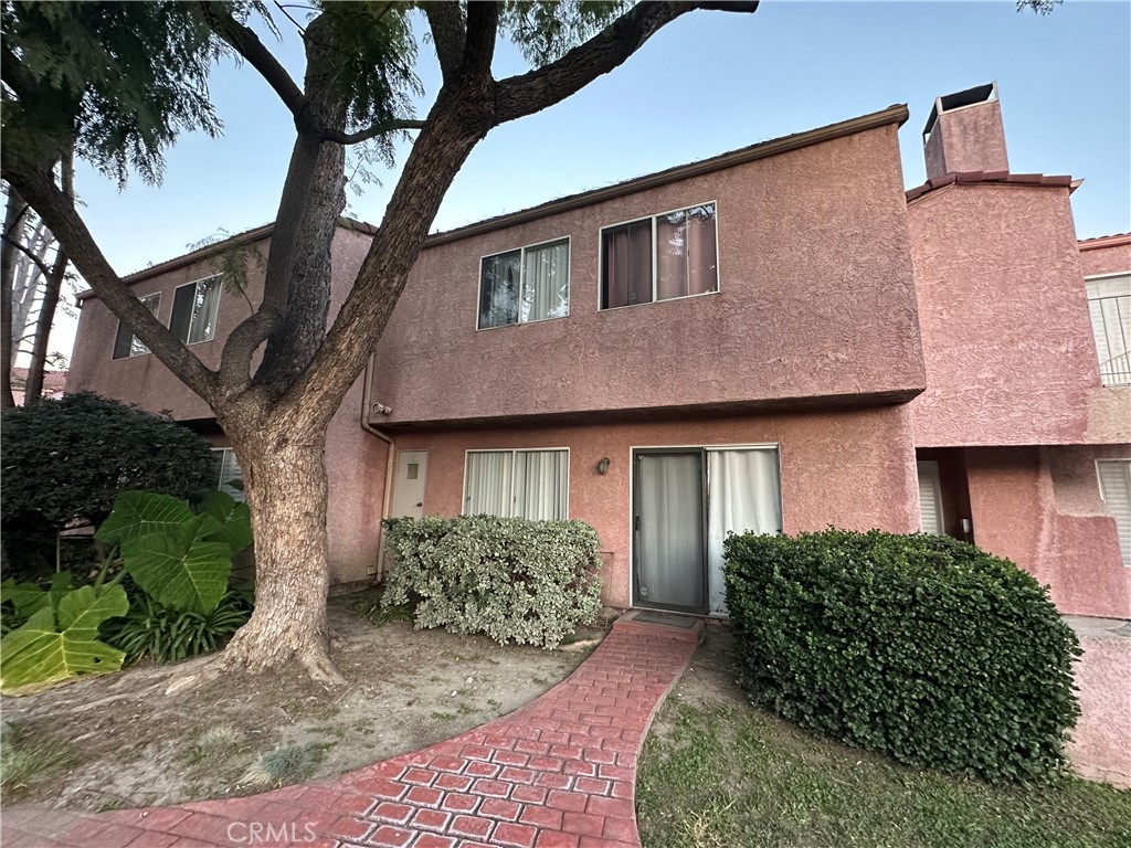 165 Racquet Club Drive Compton, CA 90220 - Photo 43 of 47 a front view of a house with garden