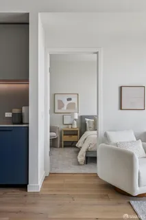 a en suite bathroom with a couch and a mirror