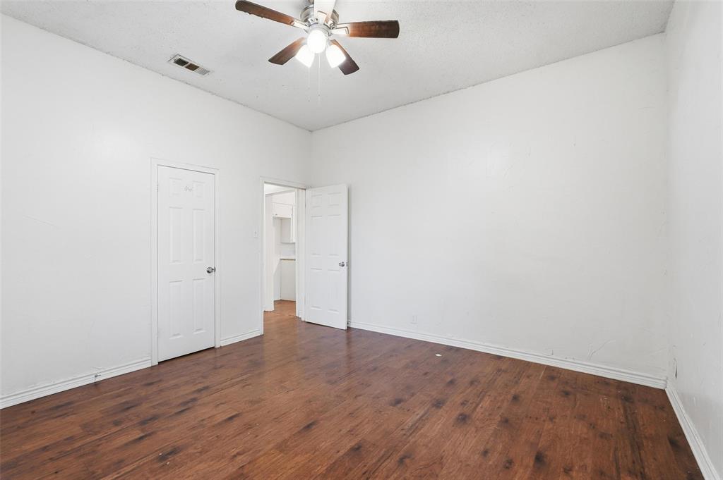 900 West Morgan Street Denison, TX 75020 - Photo 13 of 40 wooden floor in an empty room