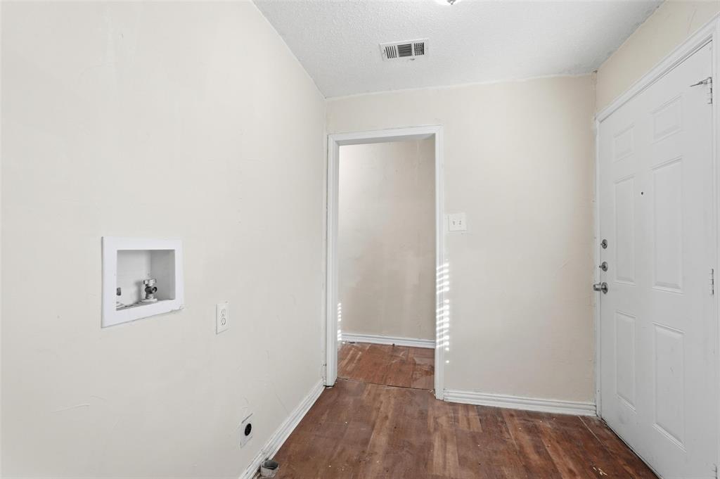 900 West Morgan Street Denison, TX 75020 - Photo 19 of 40 a view of a room with wooden floor
