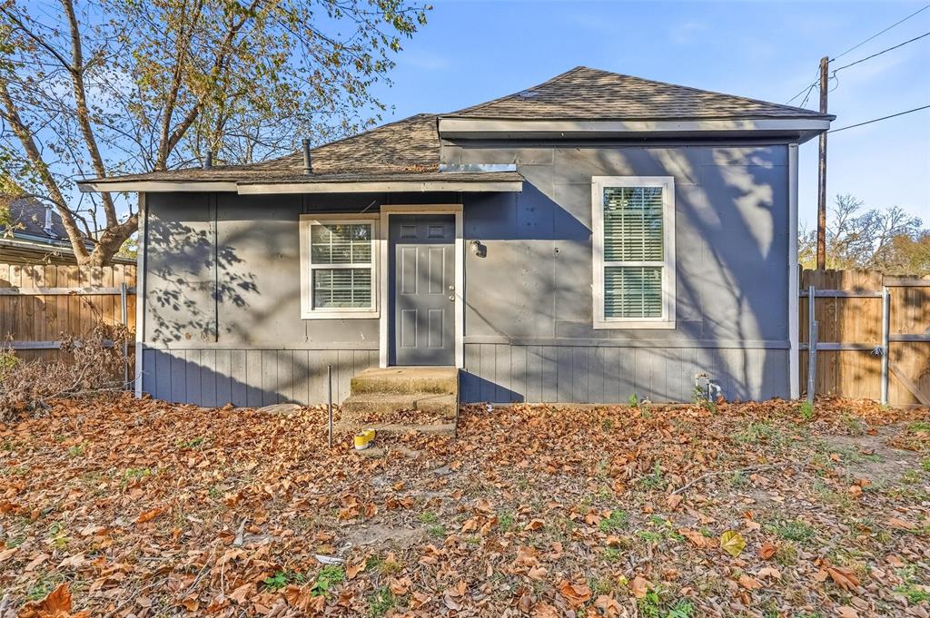 900 West Morgan Street Denison, TX 75020 - Photo 20 of 40 a front view of a house with a garden
