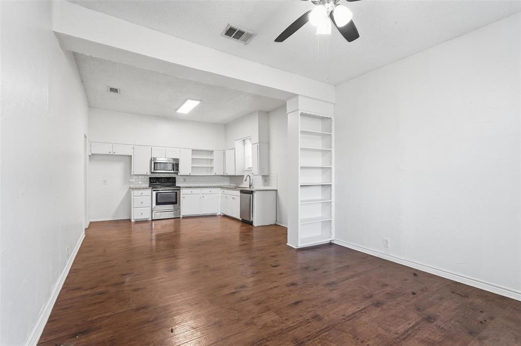 900 West Morgan Street Denison, TX 75020 - Photo 3 of 40 a view of kitchen with wooden floor