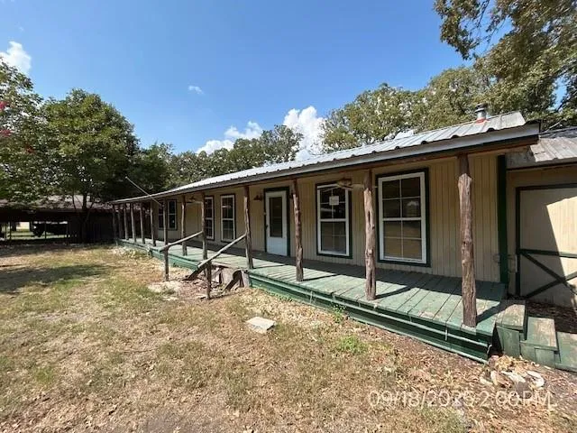 a house with trees in the background