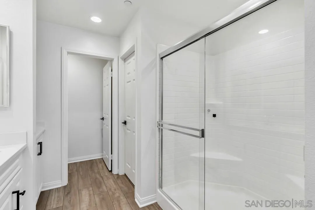2811 Safflower Street Spring Valley, CA 91977 - Photo 20 of 28 a bathroom with a shower and a glass door
