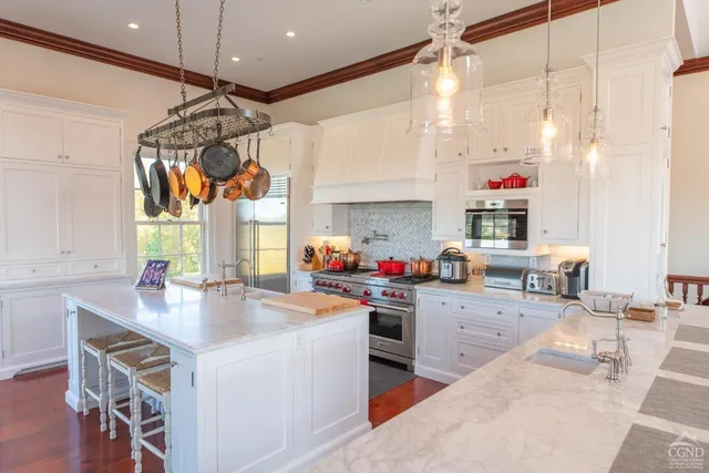 a living room with furniture wooden floor and a table