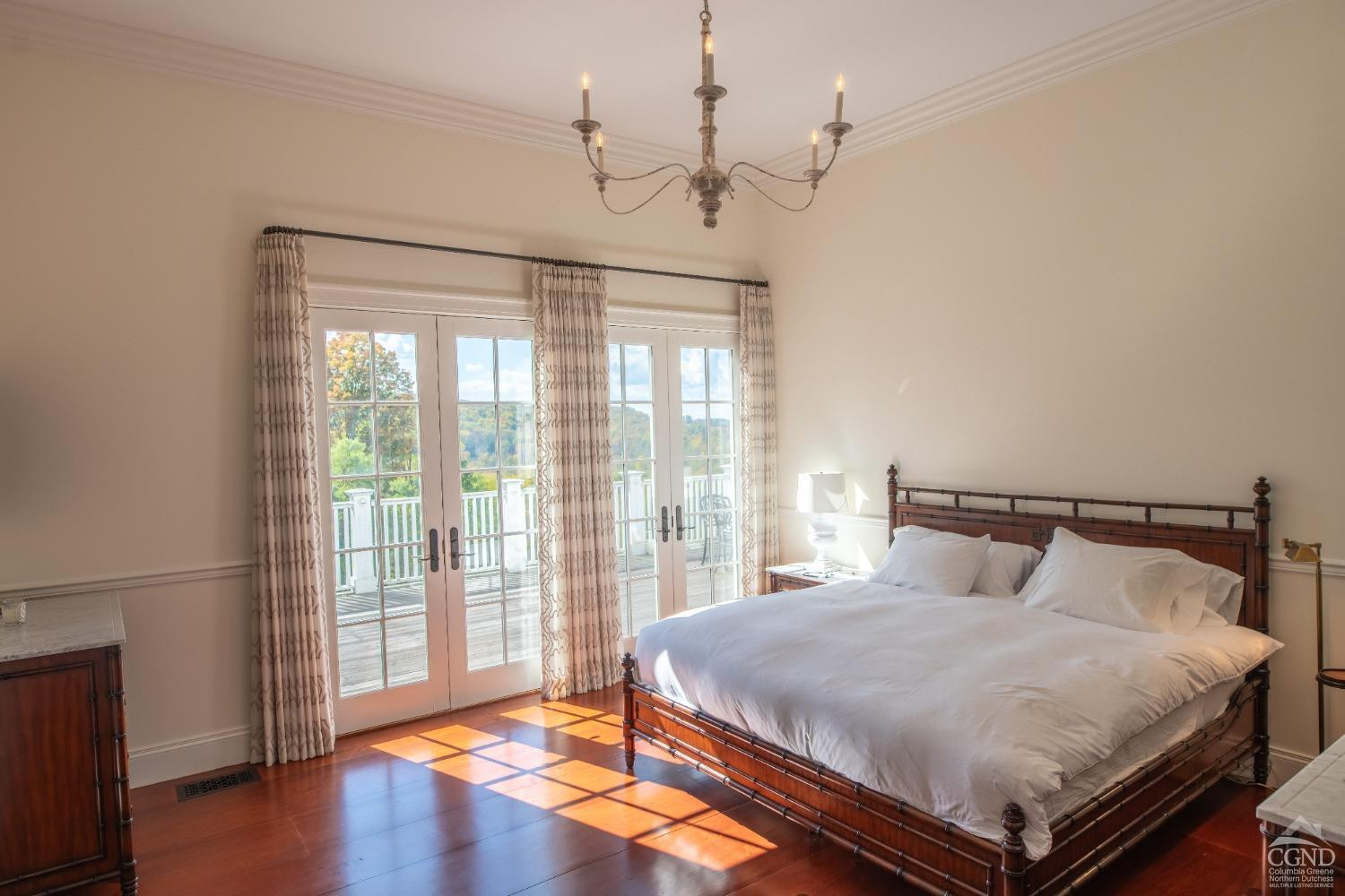 255 Mill Hill Road Gallatin, NY 12567 - Photo 17 of 29 a bedroom with a large bed and a large window