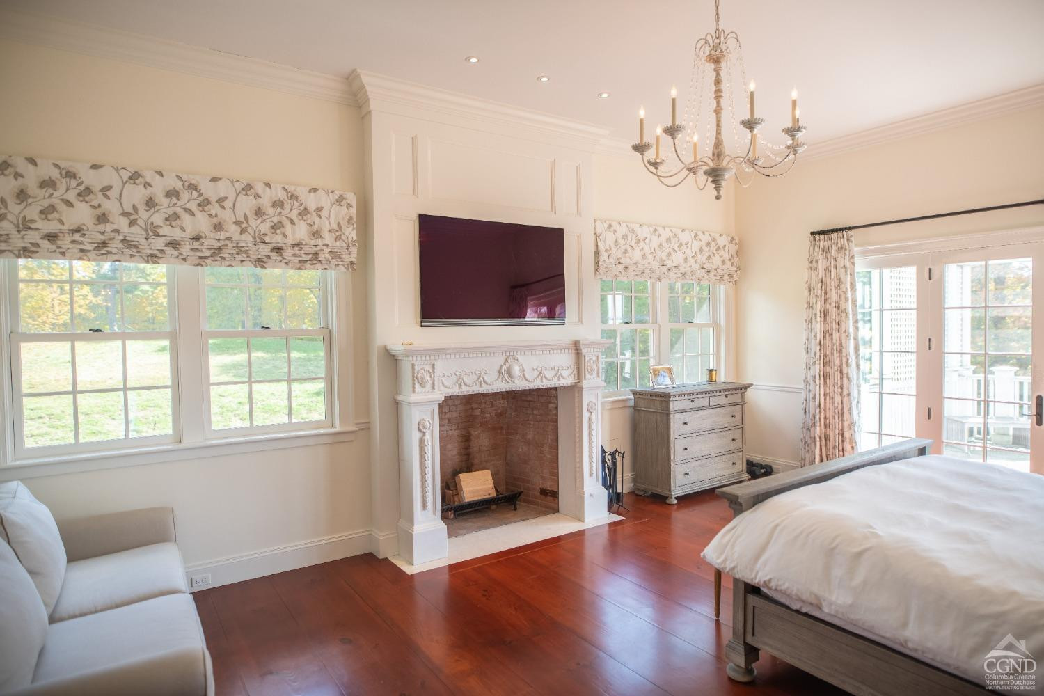 255 Mill Hill Road Gallatin, NY 12567 - Photo 19 of 29 a spacious bedroom with a bed and a flat screen tv