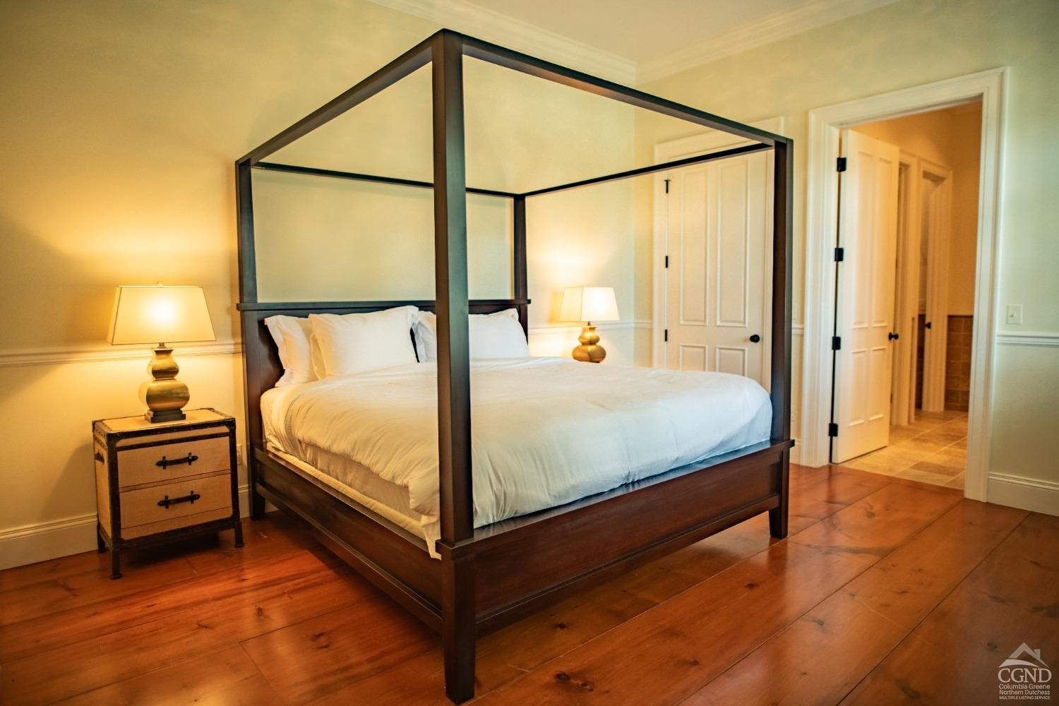 255 Mill Hill Road Gallatin, NY 12567 - Photo 22 of 29 a bedroom with a bed next to a window