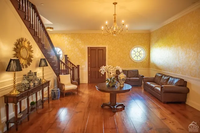 a living room with fireplace furniture and a flat screen tv