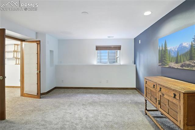 2130 Wickes Road Colorado Springs, CO 80919 - Photo 28 of 49 Carpeted bedroom with baseboards