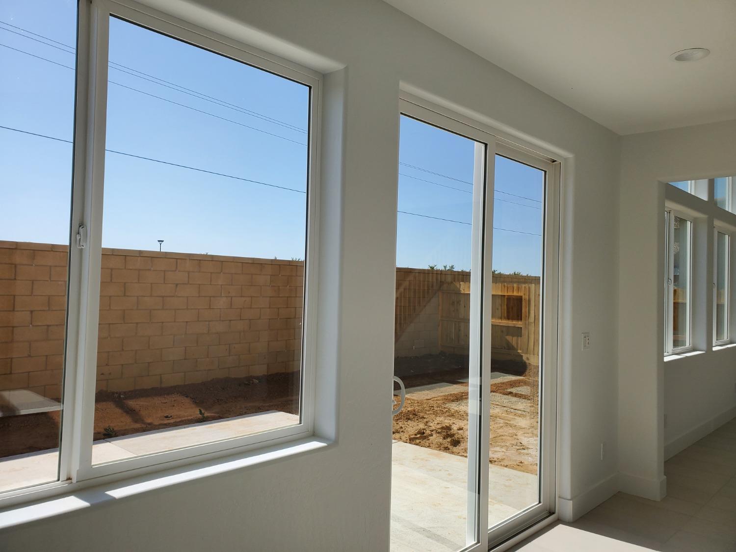496 Talus Way South Madera, CA 93636 - Photo 5 of 9 a bathroom with a glass shower door