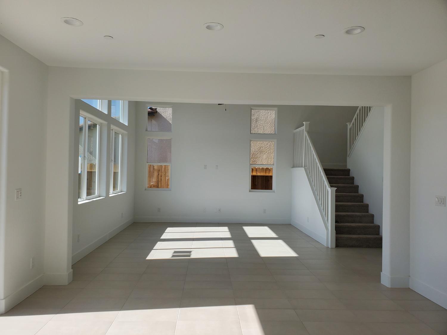 496 Talus Way South Madera, CA 93636 - Photo 7 of 9 a view of an empty room with stairs