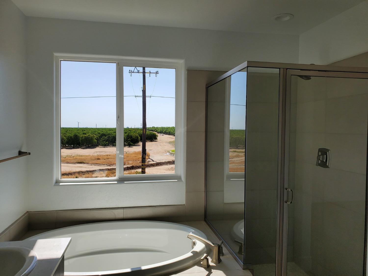 496 Talus Way South Madera, CA 93636 - Photo 9 of 9 a bathroom with a toilet and a shower