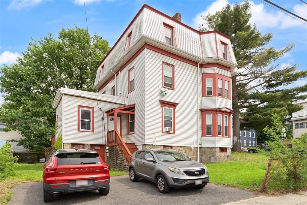 39 Union Street Boston, MA 02135 - Photo 26 of 33 a car parked in front of a house
