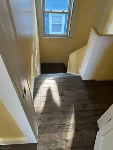 a view of balcony with wooden floor