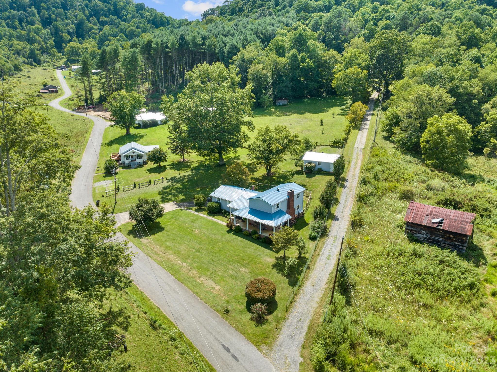 320 Wilson Branch Road Canton, NC 28716 - Photo 3 of 25 a view of a garden with a tree