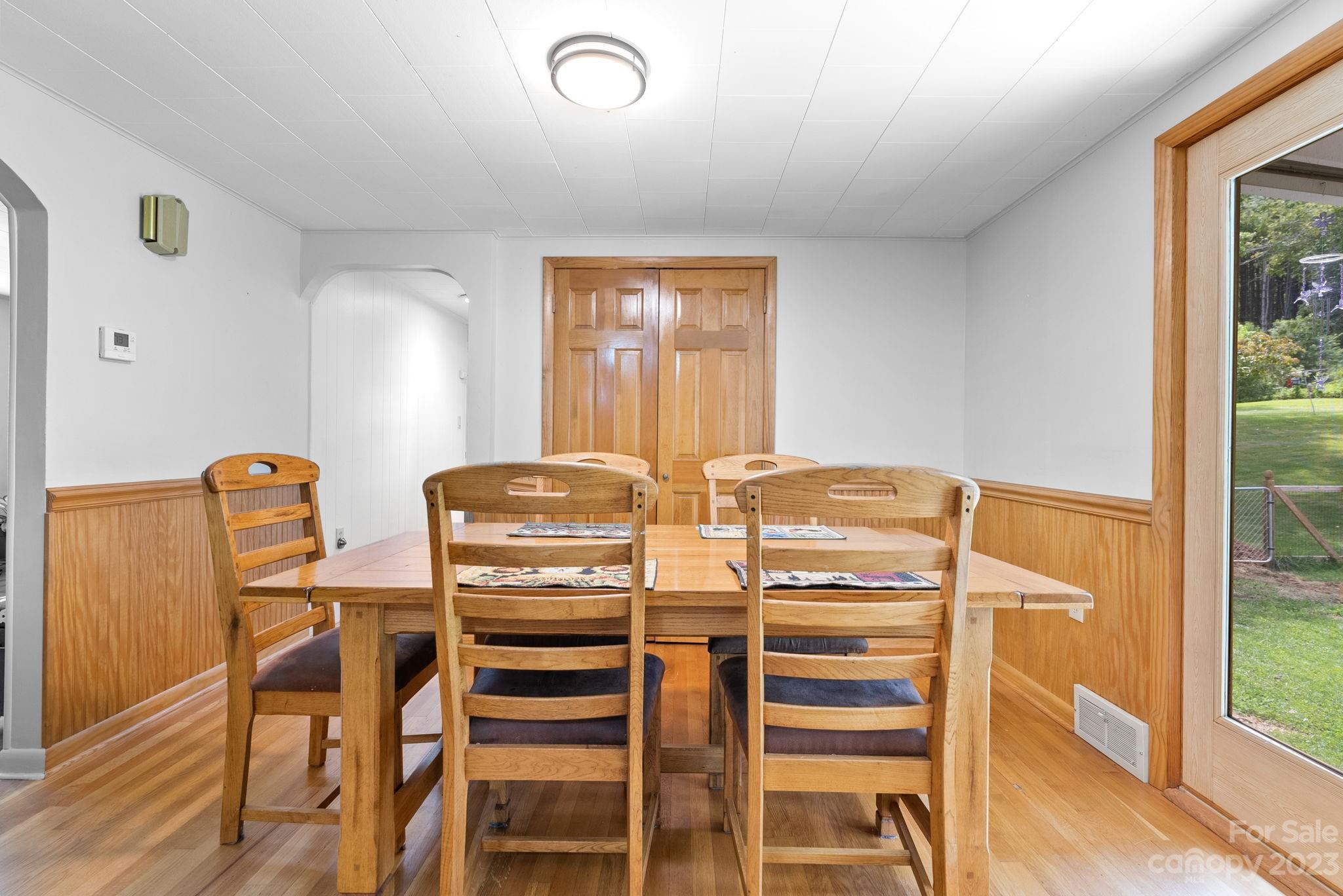 320 Wilson Branch Road Canton, NC 28716 - Photo 8 of 25 a view of a dining room with furniture and wooden floor