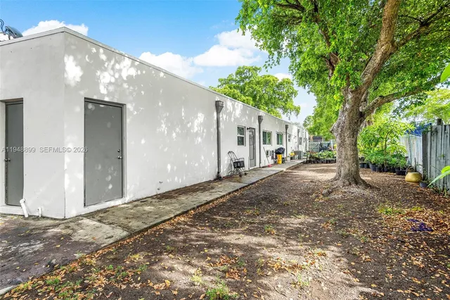 a view of a tree in front of a house