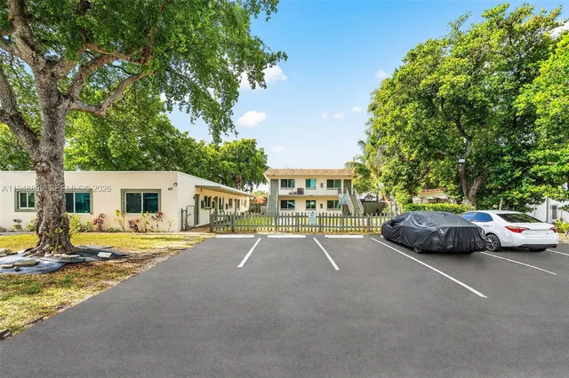 a view of street with parked cars
