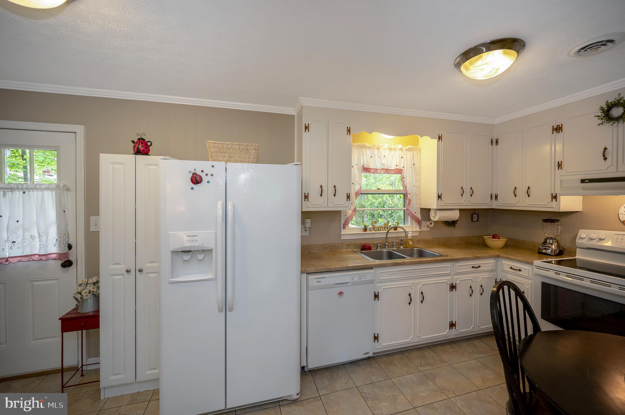 209 Birdie Road Locust Grove, VA 22508 - Photo 17 of 42 kitchen overlooks backyard