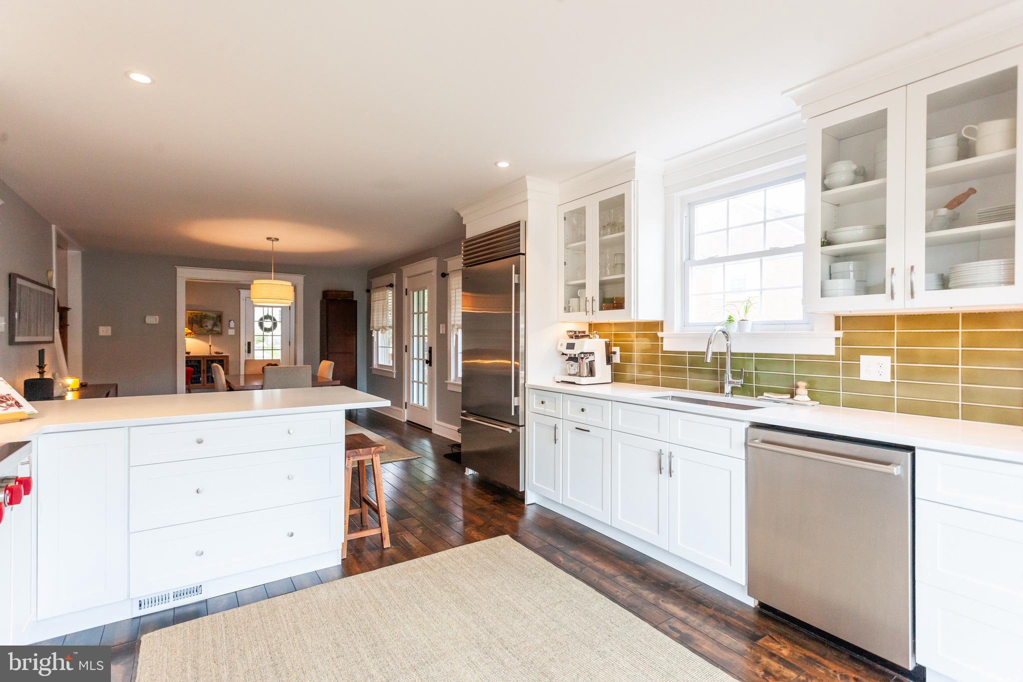 20 Moreland Road Paoli, PA 19301 - Photo 11 of 30 a large kitchen with kitchen island a sink a stove and a refrigerator