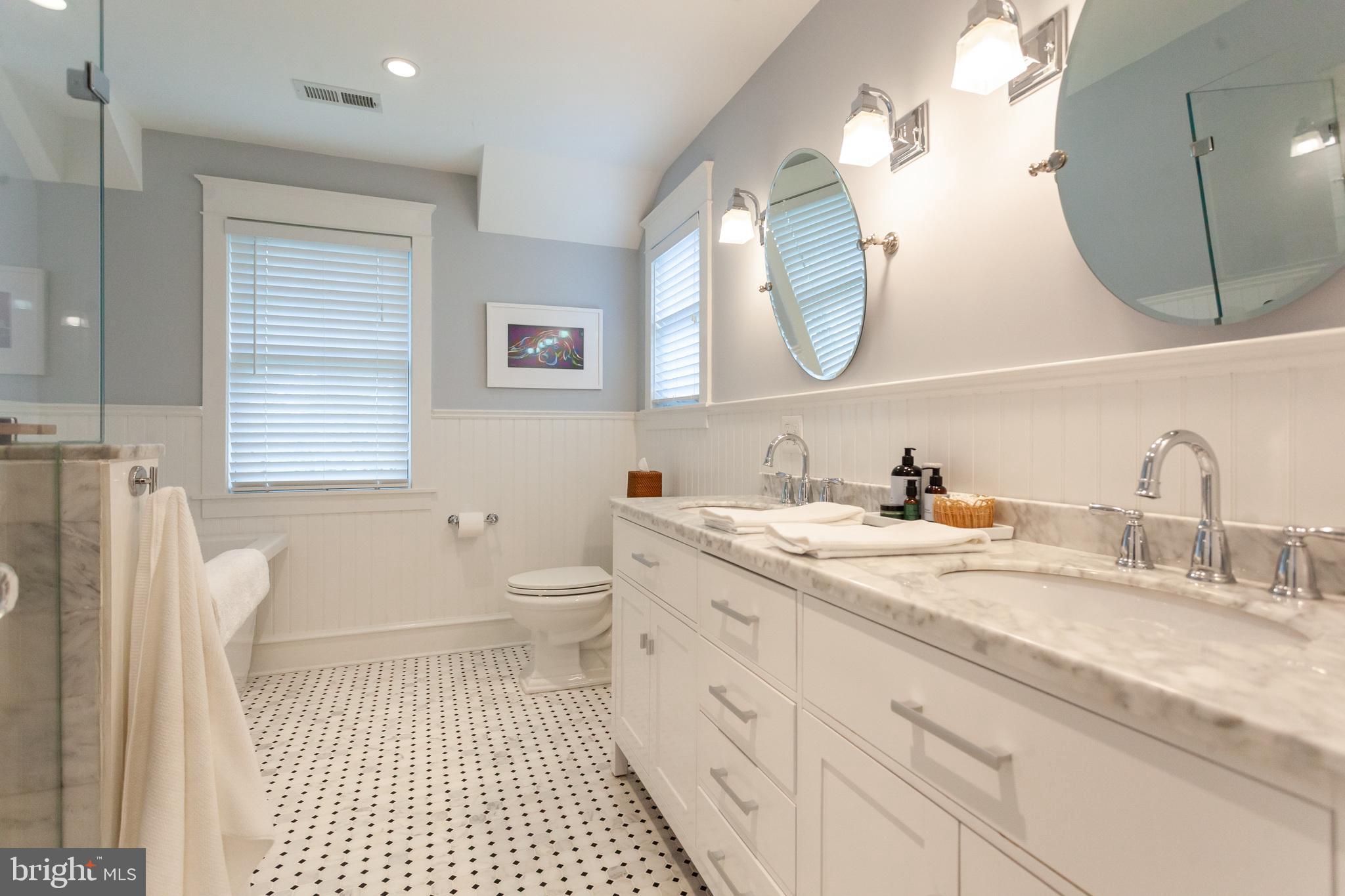 20 Moreland Road Paoli, PA 19301 - Photo 20 of 30 a bathroom with a sink a toilet and a mirror