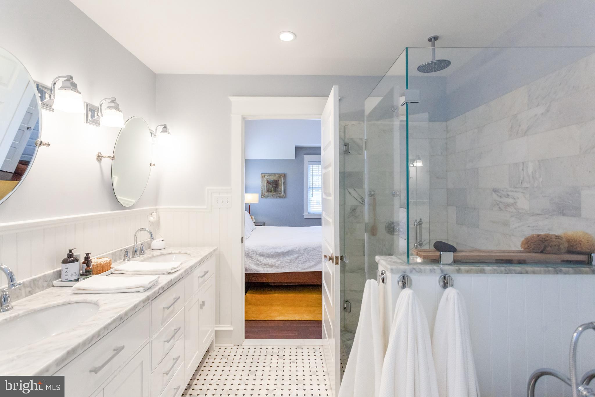 20 Moreland Road Paoli, PA 19301 - Photo 21 of 30 a bathroom with a double vanity sink and a mirror