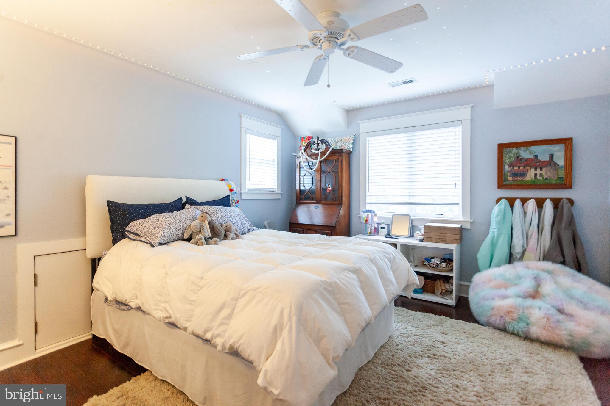 20 Moreland Road Paoli, PA 19301 - Photo 24 of 30 a bedroom with a bed and a chandelier