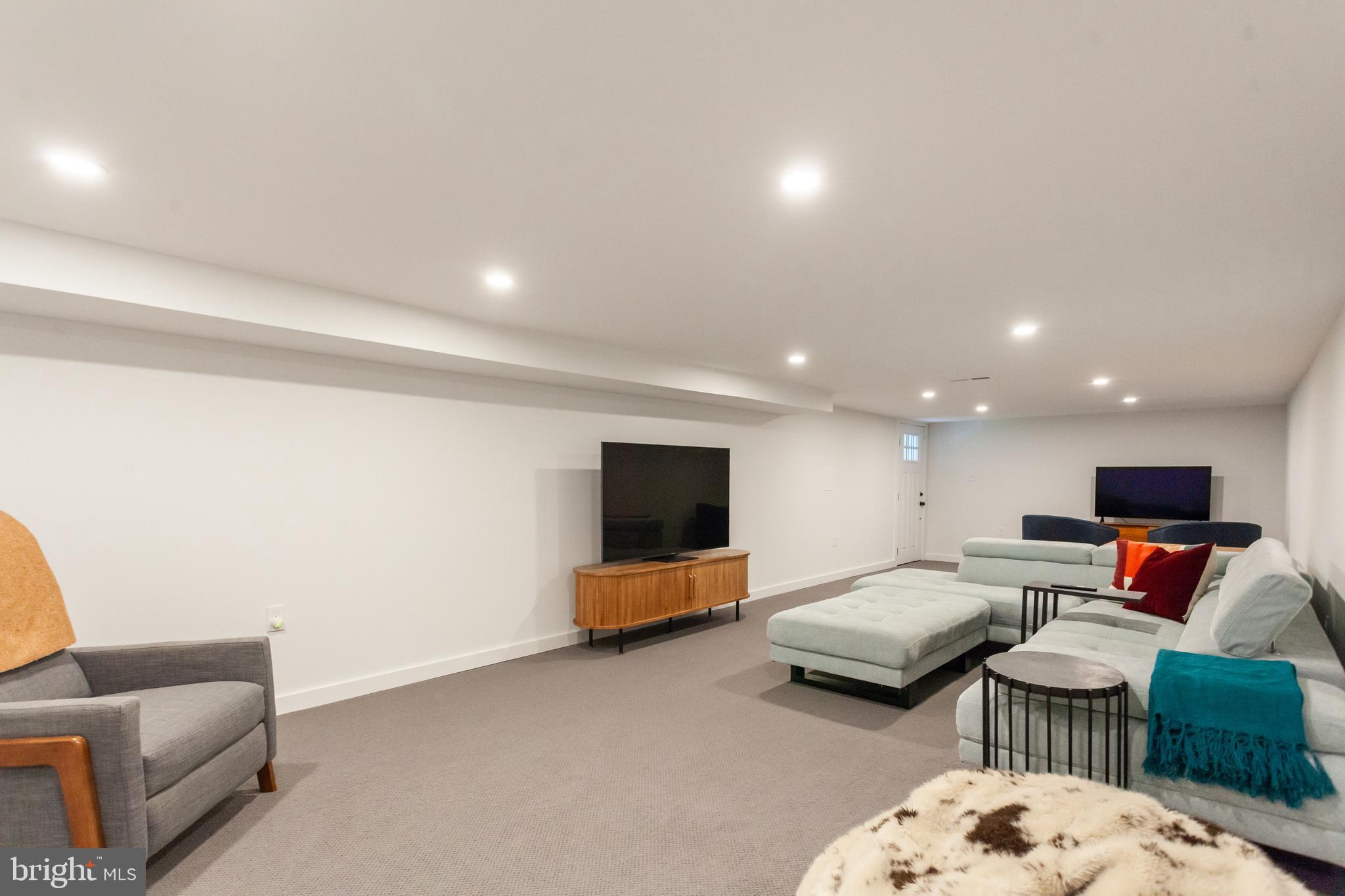 20 Moreland Road Paoli, PA 19301 - Photo 28 of 30 a living room with furniture and a flat screen tv