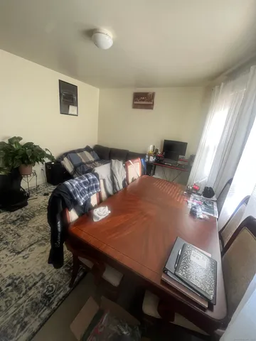 a bedroom with furniture and window