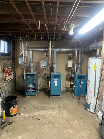 a room with gym equipment and a shower