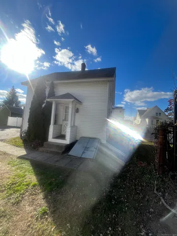a room with wooden floor and furniture