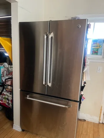 a bed room with furniture and a gym equipment