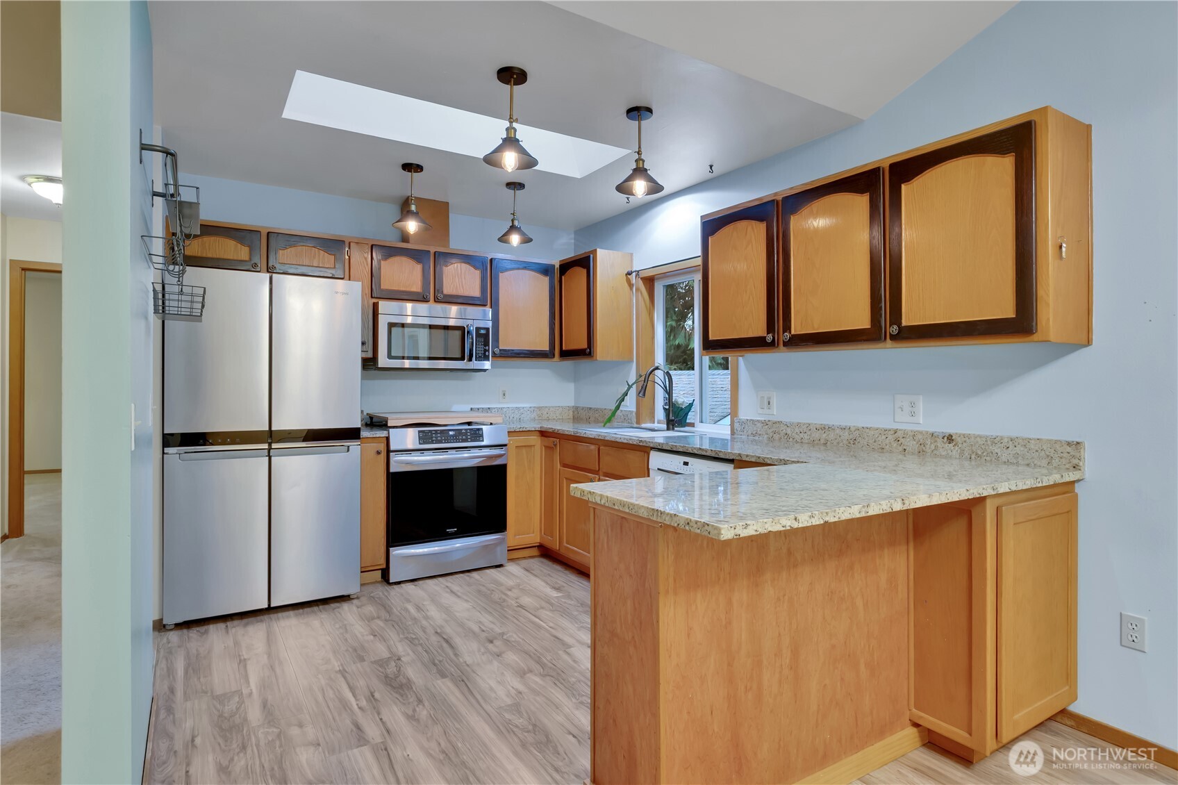 38 Brighton Street Port Hadlock, WA 98339 - Photo 10 of 32 a kitchen with stainless steel appliances granite countertop a sink refrigerator and microwave